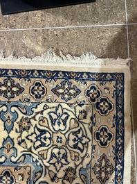 A Persian Nain rug with floral design, wool and silk on cotton, 20th C.