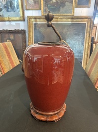 Trois vases en porcelaine monochrome jaune et sang-de-boeuf, un mont&eacute; en lampe, 19&egrave;me/20&egrave;me si&egrave;cle