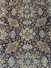 A Persian Nain rug with floral design, wool and silk on cotton, 20th C.