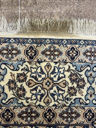 A Persian Nain rug with floral design, wool and silk on cotton, 20th C.
