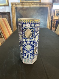 A Chinese reticulated hexagonal blue ground famille rose hatstand, 19th C.