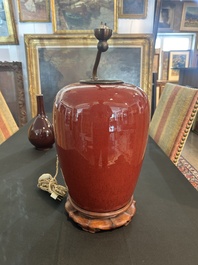 Trois vases en porcelaine monochrome jaune et sang-de-boeuf, un mont&eacute; en lampe, 19&egrave;me/20&egrave;me si&egrave;cle