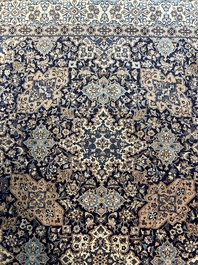 A Persian Nain rug with floral design, wool and silk on cotton, 20th C.