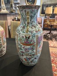 A pair of Chinese Canton famille rose vases with palace scenes and floral design, 19th C.