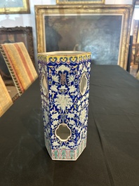 A Chinese reticulated hexagonal blue ground famille rose hatstand, 19th C.