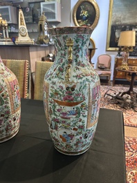 A pair of Chinese Canton famille rose vases with palace scenes and floral design, 19th C.