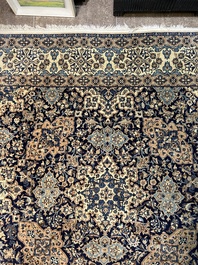 A Persian Nain rug with floral design, wool and silk on cotton, 20th C.