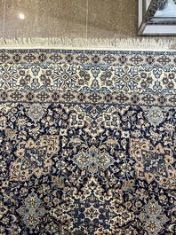 A Persian Nain rug with floral design, wool and silk on cotton, 20th C.