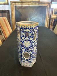 A Chinese reticulated hexagonal blue ground famille rose hatstand, 19th C.