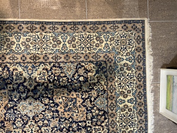 A Persian Nain rug with floral design, wool and silk on cotton, 20th C.