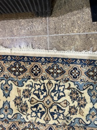 A Persian Nain rug with floral design, wool and silk on cotton, 20th C.