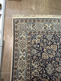 A Persian Nain rug with floral design, wool and silk on cotton, 20th C.