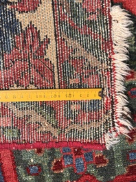 A Persian Bakhtiar rug with floral design, wool on cotton, 20th C.