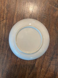 A pair of Chinese famille rose saucers with butterflies on a ruby red ground, 19th/20th C.