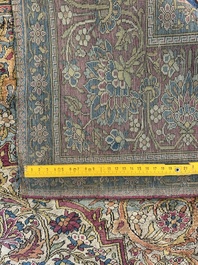 A Persian Kashan 'Mohtashem' silk rug with floral design, early 20th C.