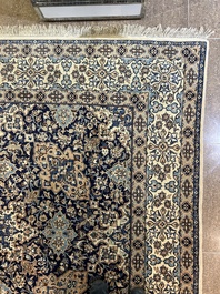 A Persian Nain rug with floral design, wool and silk on cotton, 20th C.