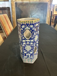 A Chinese reticulated hexagonal blue ground famille rose hatstand, 19th C.