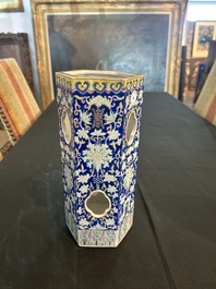 A Chinese reticulated hexagonal blue ground famille rose hatstand, 19th C.