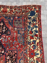 A Persian Bakhtiar rug with floral design, wool on cotton, 20th C.