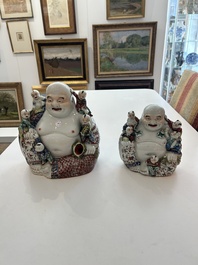 Two Chinese famille rose figures of Buddha with children, 19th/20th C.