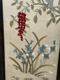 Four Chinese vertical silk embroideries with birds among blossoming branches, 20th C.