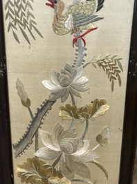 Four Chinese vertical silk embroideries with birds among blossoming branches, 20th C.