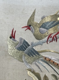 Four Chinese vertical silk embroideries with birds among blossoming branches, 20th C.