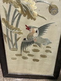 Four Chinese vertical silk embroideries with birds among blossoming branches, 20th C.