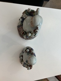 Two Chinese famille rose figures of Buddha with children, 19th/20th C.