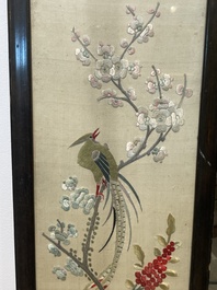 Four Chinese vertical silk embroideries with birds among blossoming branches, 20th C.