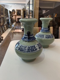 A pair of Chinese blue and white celadon 'kui dragons' vases, 19th/20th C.