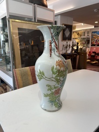 Two Chinese famille rose and qianjiang cai vases with birds among blossoming branches, 19th/20th C.
