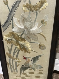 Four Chinese vertical silk embroideries with birds among blossoming branches, 20th C.