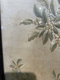 Four Chinese vertical silk embroideries with birds among blossoming branches, 20th C.