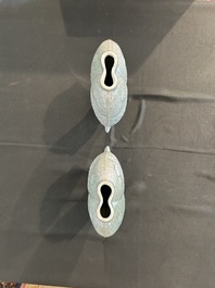 A pair of Chinese celadon glazed 'twin fish' vases, 19th/20th C.