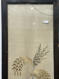 Four Chinese vertical silk embroideries with birds among blossoming branches, 20th C.