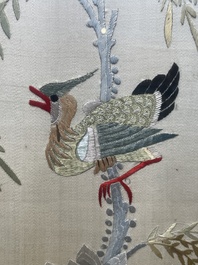 Four Chinese vertical silk embroideries with birds among blossoming branches, 20th C.