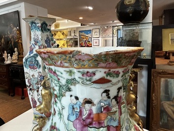A pair of Chinese Canton famille rose vases with palace scenes and floral design, 19th C.