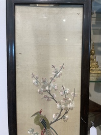Four Chinese vertical silk embroideries with birds among blossoming branches, 20th C.