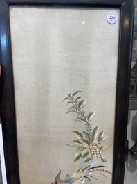 Four Chinese vertical silk embroideries with birds among blossoming branches, 20th C.