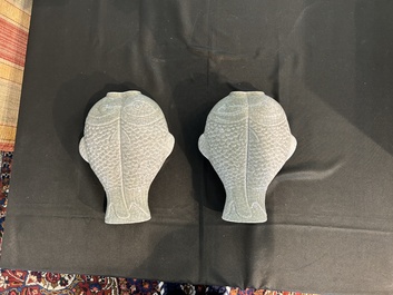 A pair of Chinese celadon glazed 'twin fish' vases, 19th/20th C.