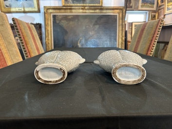 A pair of Chinese celadon glazed 'twin fish' vases, 19th/20th C.