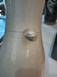A Chinese white glazed 'hu' vase, 19th C.