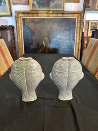 A pair of Chinese celadon glazed 'twin fish' vases, 19th/20th C.
