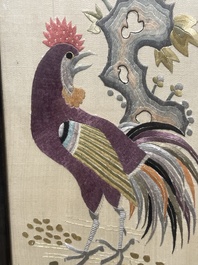 Four Chinese vertical silk embroideries with birds among blossoming branches, 20th C.