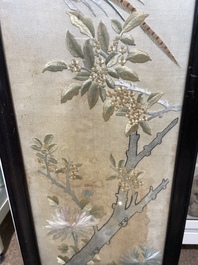 Four Chinese vertical silk embroideries with birds among blossoming branches, 20th C.
