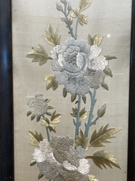 Four Chinese vertical silk embroideries with birds among blossoming branches, 20th C.