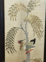 Four Chinese vertical silk embroideries with birds among blossoming branches, 20th C.