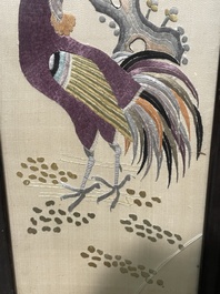 Four Chinese vertical silk embroideries with birds among blossoming branches, 20th C.