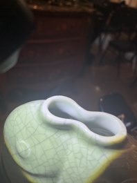 A pair of Chinese celadon glazed 'twin fish' vases, 19th/20th C.